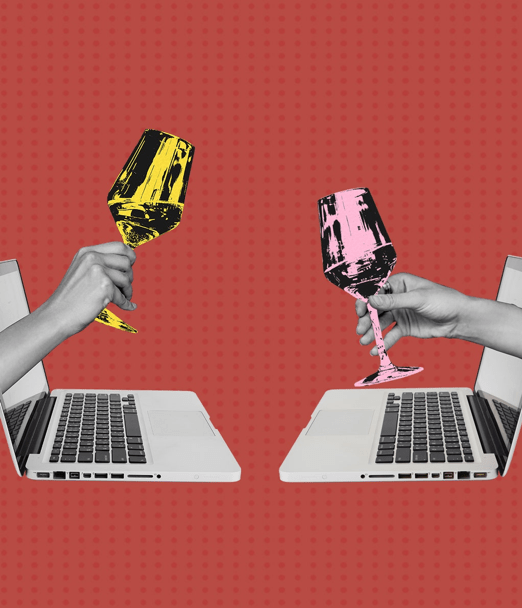 Two hands with a glass of wine coming out of their computers cheering to represent connection when social distancing