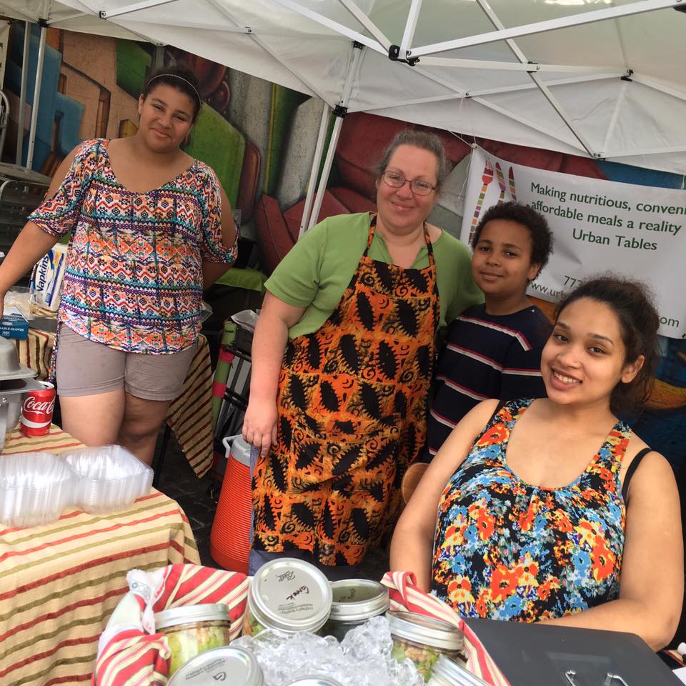 Autumn Williams, Founder of Urban Tables, with her family at their Chicago Farmers' Market station